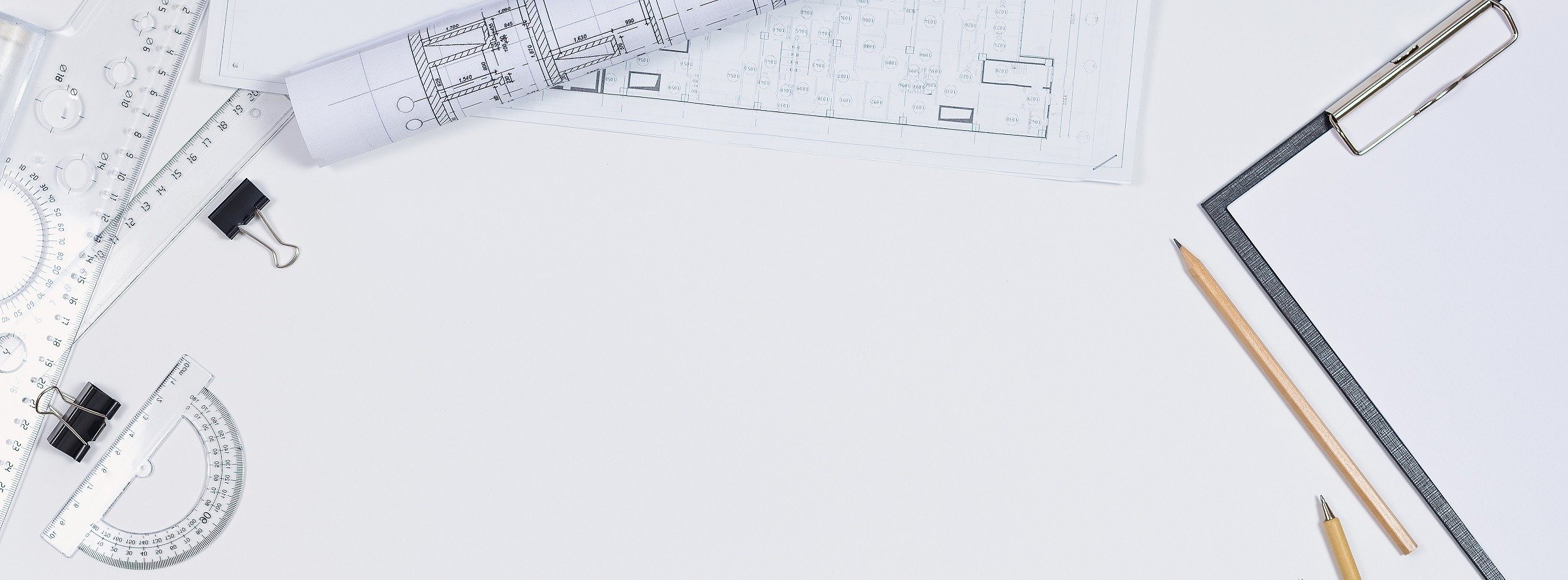 Architectural plans, pencil and ruler on the table. Working surface. Place for your text. View from above.
