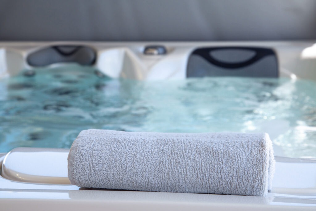 close-up of bath towel placed on the edge of a therapeutic spa