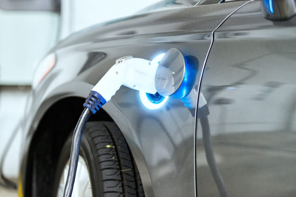 Electric power cord plugged in and recharging the electric vehicle.