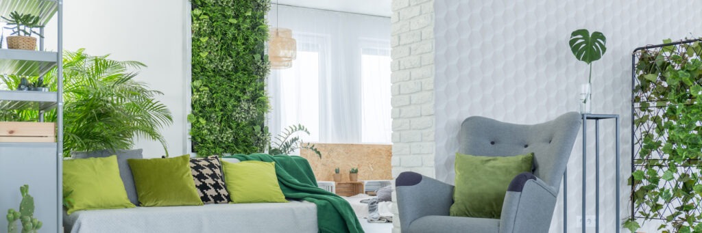 Green decoration in grey and white living room
